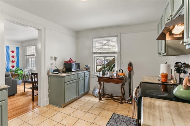 kitchen featuring light hardwood / wood-style floors and stove