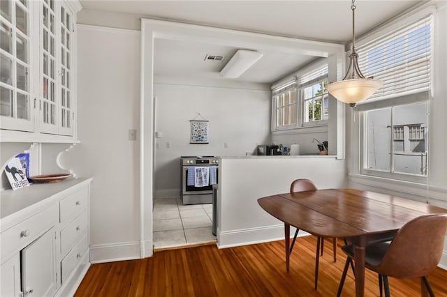 dining room with hardwood / wood-style floors