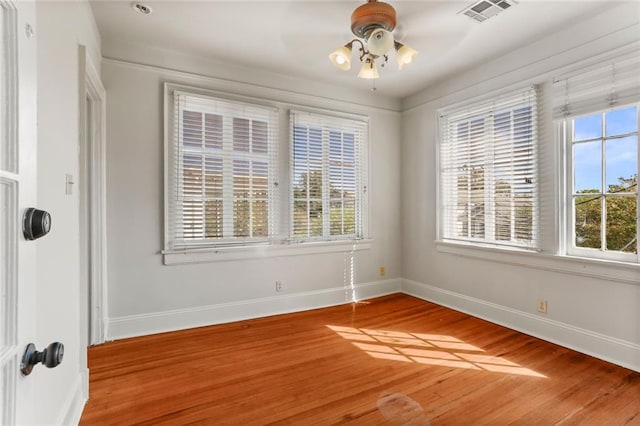 unfurnished room featuring hardwood / wood-style flooring and ceiling fan