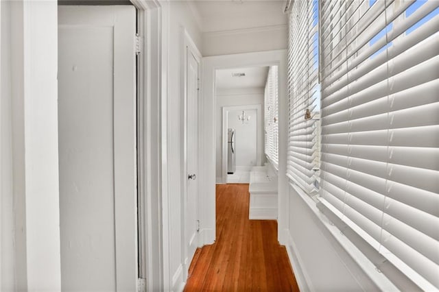 hallway with hardwood / wood-style flooring