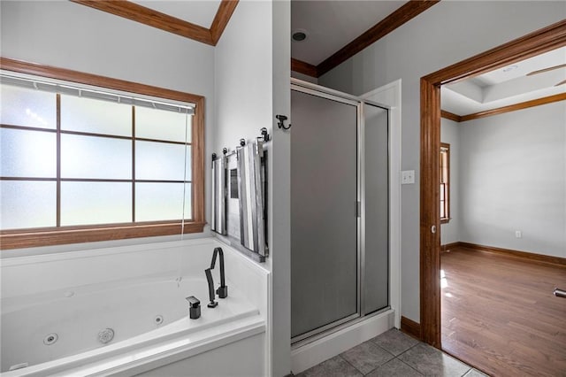 bathroom with independent shower and bath, wood-type flooring, and ornamental molding