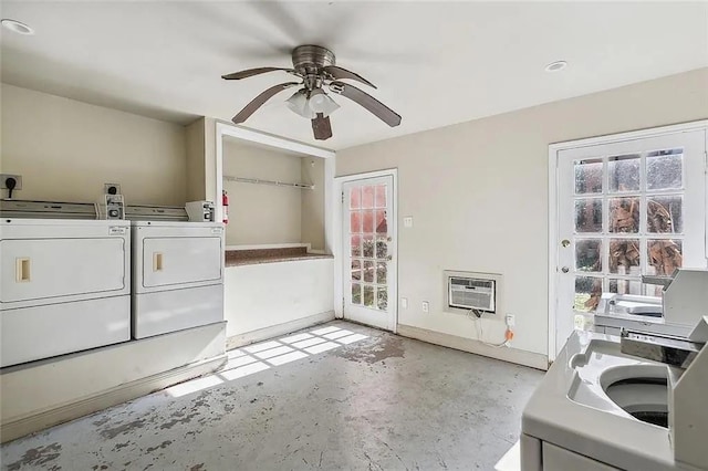 laundry room with washer and dryer, a wall unit AC, and ceiling fan