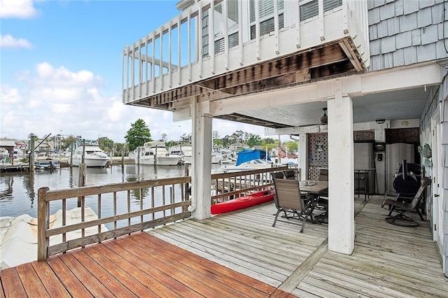 969 Marina Blvd Unit 969, Mandeville, LA 70471 - dock area with outdoor dining space and a water view
