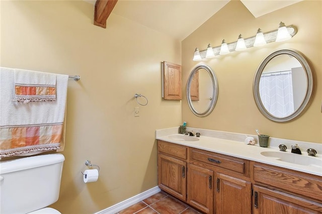969 Marina Blvd Unit 969, Mandeville, LA 70471 - bathroom featuring baseboards, double vanity, toilet, a sink, and tile patterned flooring