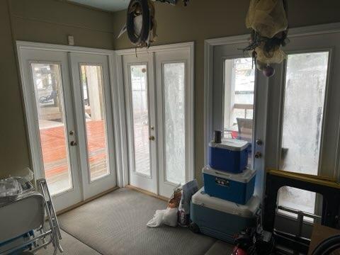 entryway featuring carpet flooring and french doors