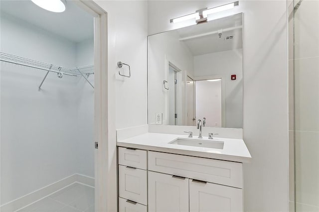 full bathroom with tile patterned floors, shower / bath combination with glass door, and vanity