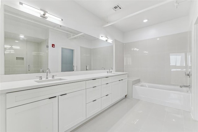 full bathroom featuring a sink, visible vents, a stall shower, and double vanity