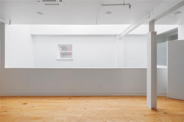 basement featuring light wood-type flooring