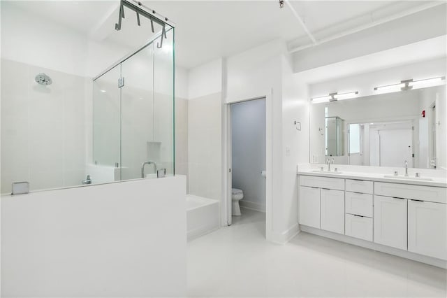 bathroom featuring walk in shower, vanity, and toilet