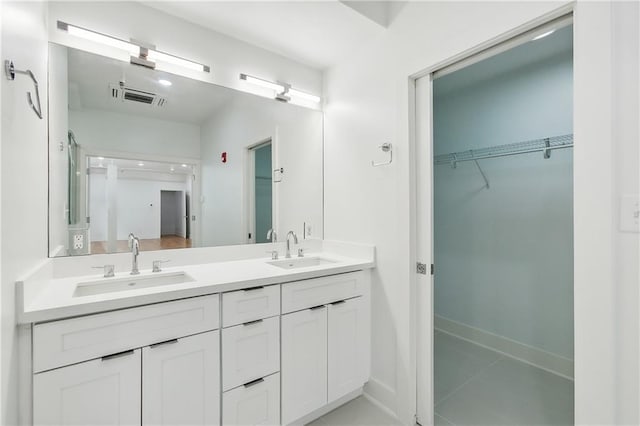 bathroom with vanity and tile patterned flooring