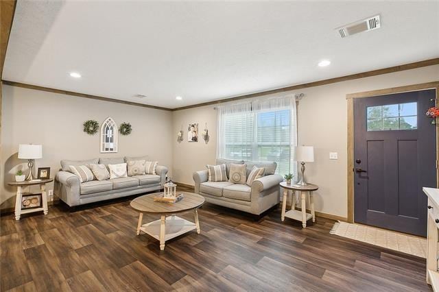 living room with dark hardwood / wood-style floors and ornamental molding