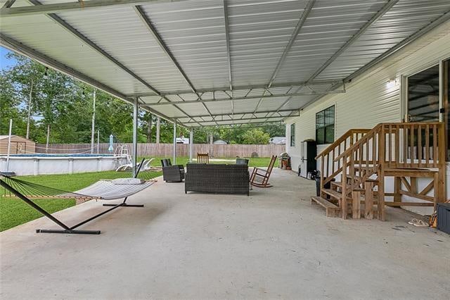 view of patio / terrace featuring a fenced in pool and an outdoor hangout area