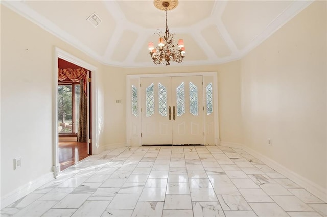 entryway featuring crown molding and a chandelier