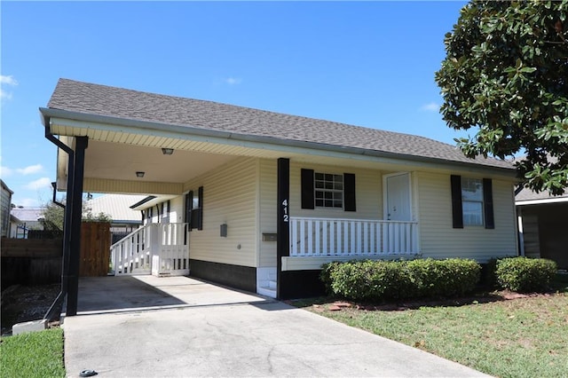 view of front of home featuring a porch and a carport