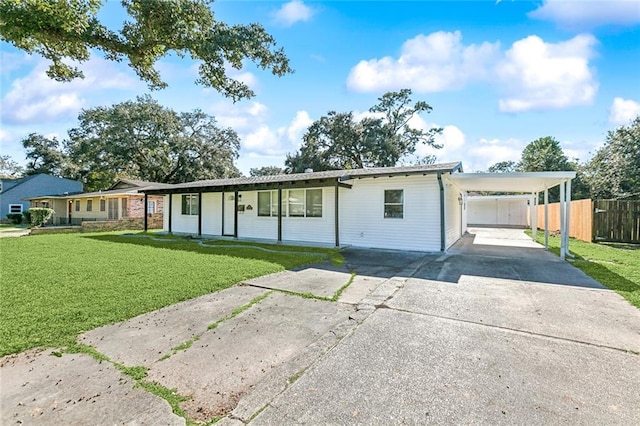 ranch-style house with a carport, a porch, and a front lawn