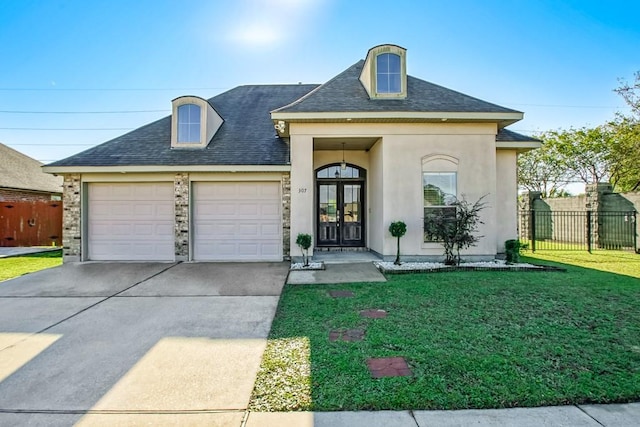 view of front facade featuring a garage and a front lawn