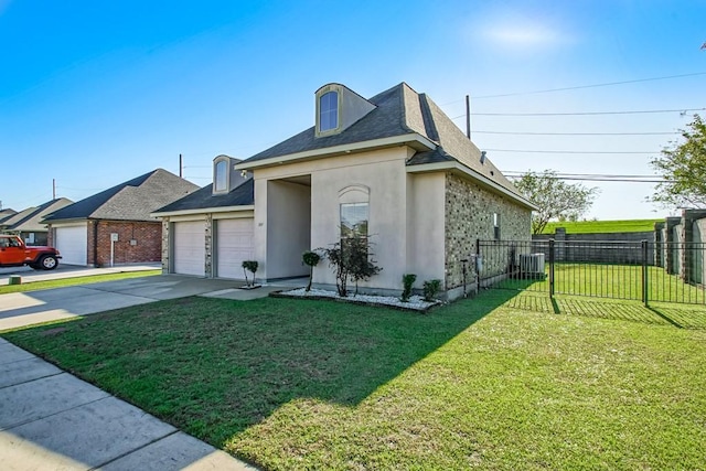 view of front facade featuring a garage, central AC, and a front lawn