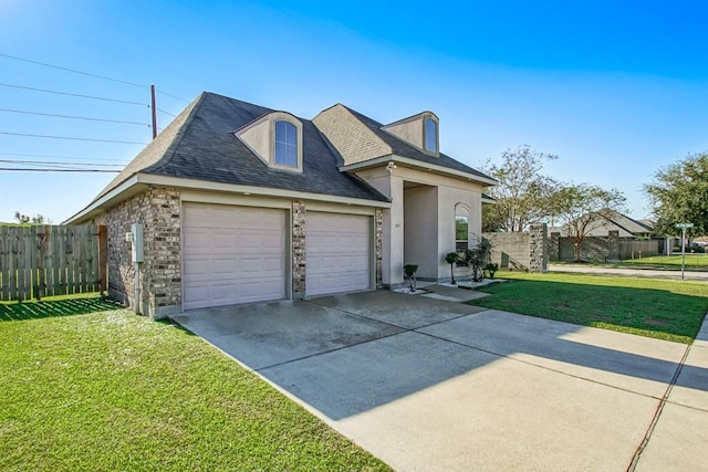 view of front of house featuring a garage and a front lawn