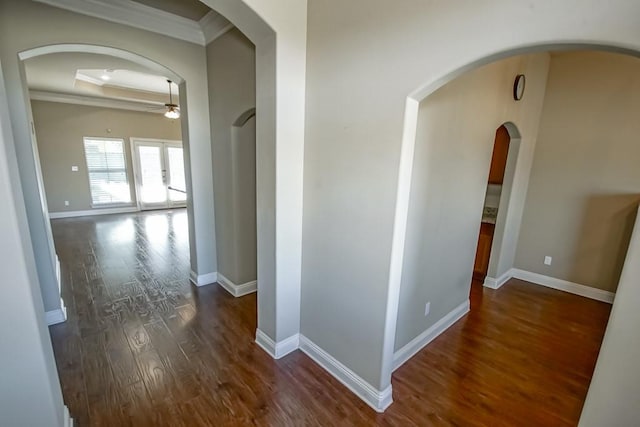 hall with crown molding and dark hardwood / wood-style flooring