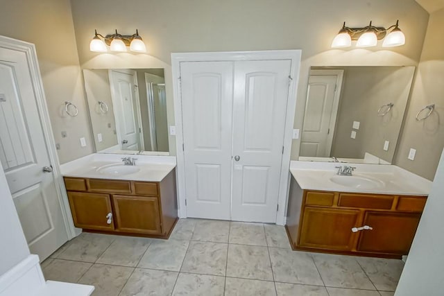 bathroom featuring tile patterned flooring and vanity