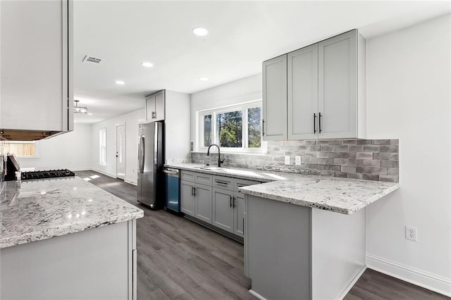 1917 Generes Dr, Harahan, LA 70123 - kitchen featuring freestanding refrigerator, dishwashing machine, gray cabinets, dark wood finished floors, and backsplash