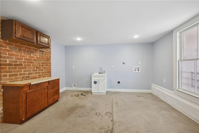 clothes washing area with washer hookup, electric dryer hookup, and light colored carpet