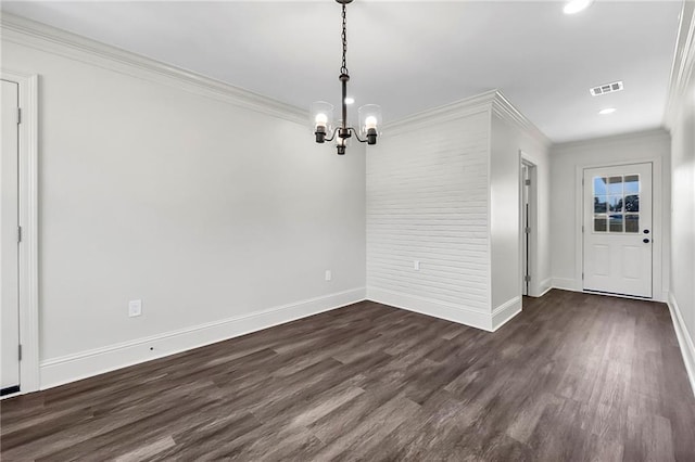 unfurnished dining area with a chandelier, ornamental molding, and dark hardwood / wood-style floors