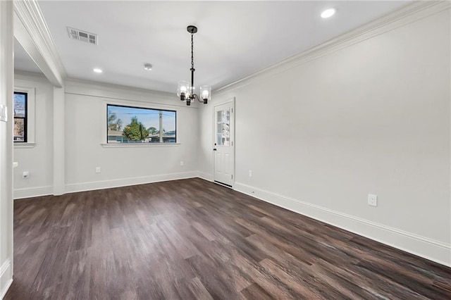 unfurnished dining area with a chandelier, crown molding, and dark hardwood / wood-style floors