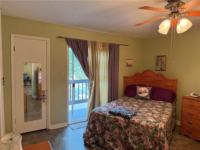 bedroom with access to outside, ceiling fan, and a textured ceiling