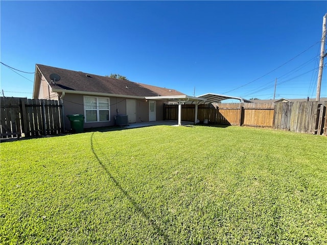 rear view of property with a yard and cooling unit