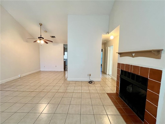 unfurnished living room featuring a tile fireplace, ceiling fan, high vaulted ceiling, and light tile patterned floors