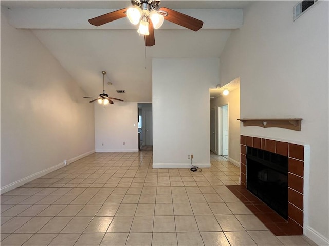 unfurnished living room featuring light tile patterned flooring, beam ceiling, high vaulted ceiling, and a tiled fireplace