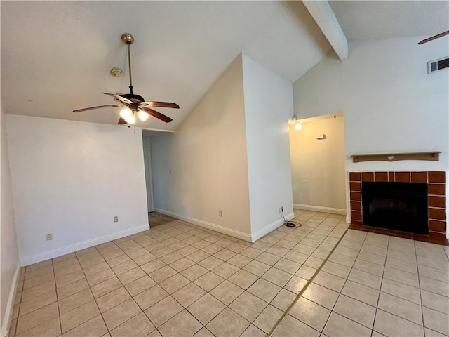 unfurnished living room with a fireplace, vaulted ceiling with beams, ceiling fan, and light tile patterned flooring