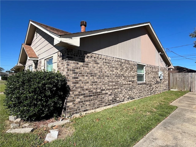 view of home's exterior featuring a yard