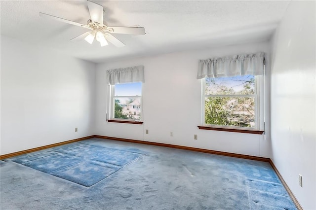 unfurnished room with carpet floors, ceiling fan, and a healthy amount of sunlight