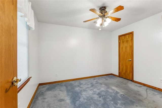 carpeted empty room with ceiling fan