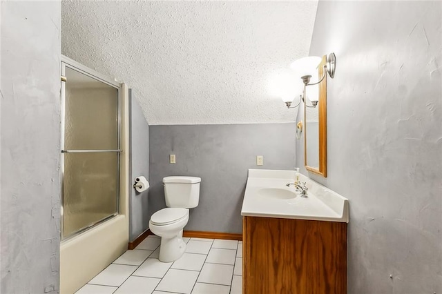 full bathroom featuring combined bath / shower with glass door, vanity, a textured ceiling, vaulted ceiling, and toilet