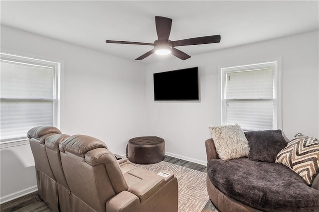 living room with ceiling fan and dark hardwood / wood-style floors