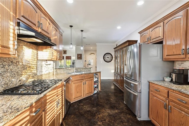 kitchen featuring backsplash, ornamental molding, stainless steel appliances, sink, and decorative light fixtures