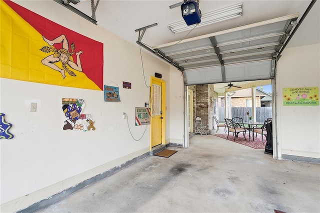 garage featuring ceiling fan and a garage door opener