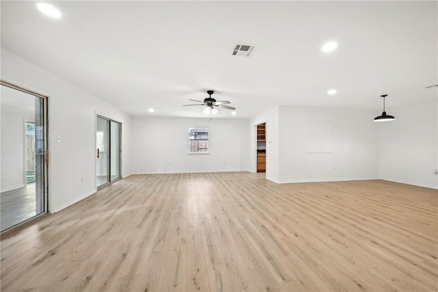 unfurnished living room with light hardwood / wood-style flooring and ceiling fan