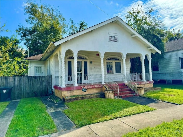 view of front of property with a front lawn and a porch