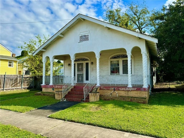 view of front of house featuring a front yard and a porch