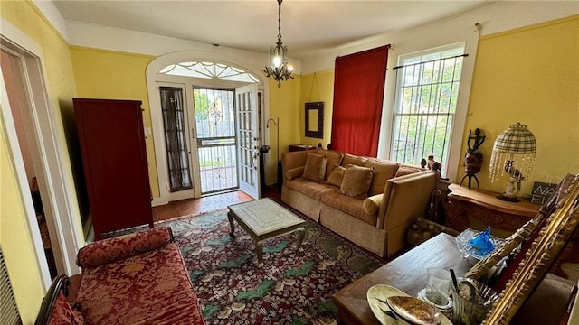 living room featuring hardwood / wood-style flooring and a notable chandelier