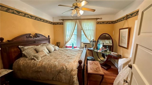 bedroom with hardwood / wood-style floors and ceiling fan