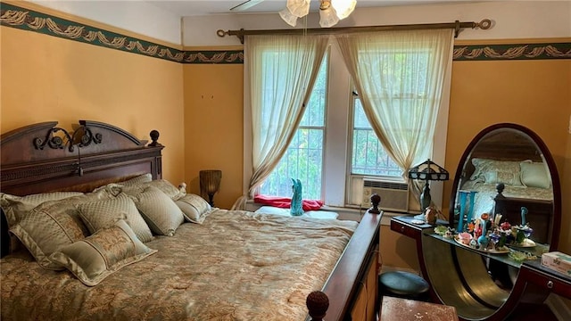 bedroom featuring ceiling fan and cooling unit