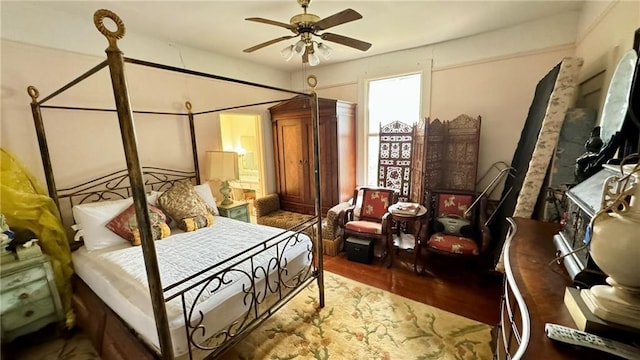 bedroom featuring hardwood / wood-style flooring and ceiling fan