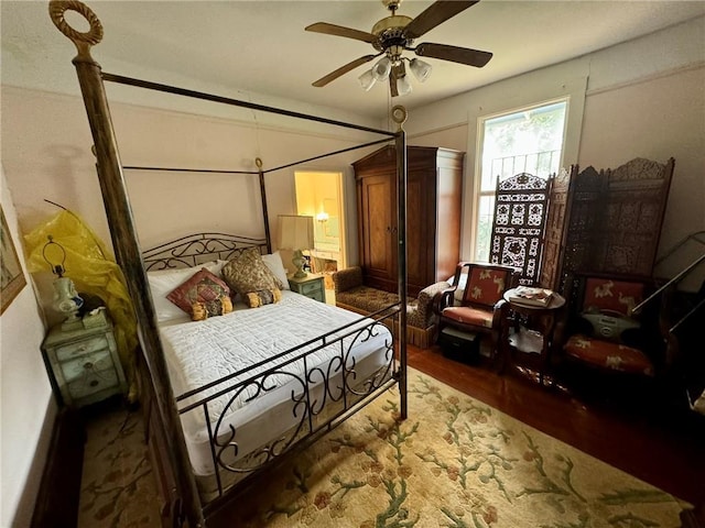 bedroom featuring hardwood / wood-style flooring and ceiling fan