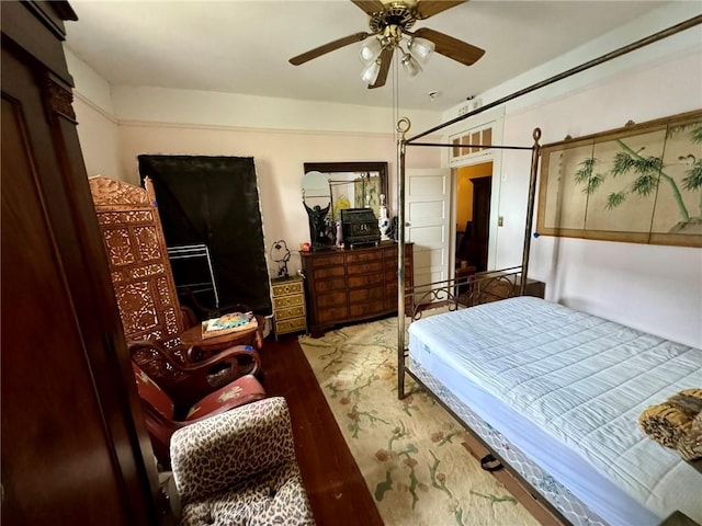 bedroom featuring light hardwood / wood-style flooring and ceiling fan