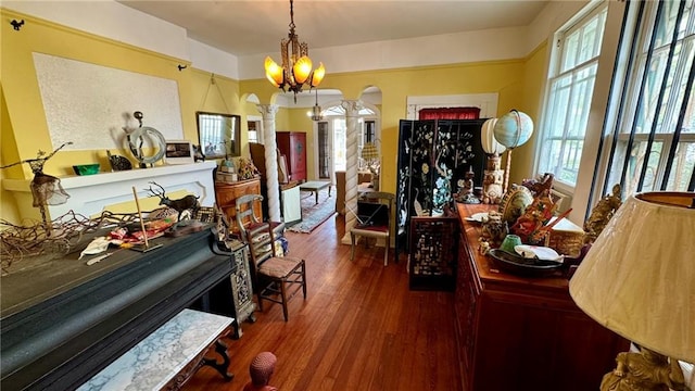 miscellaneous room with dark hardwood / wood-style flooring and a notable chandelier